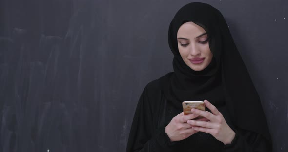 Portrait of Beautiful Muslim Woman in Fashionable Dress with Hijab Making Traditional Prayer to God