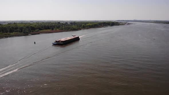 Motor Freighter Cruising On River In South Holland, Netherlands. aerial