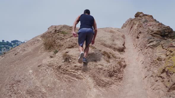 Asian Man Trail Running In San Francisco