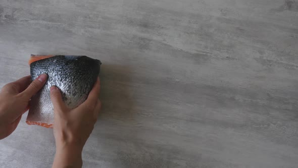 Woman Hands Put Salmon Fillet on Table