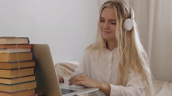 Girl Using a Laptop Computer at Home