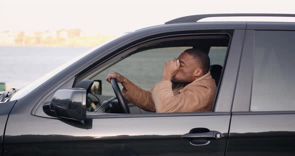 Young Black Driver Behind the Wheel of a Car