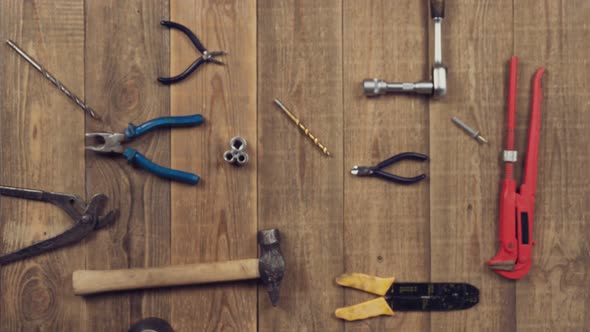 Animation of Tools on Wooden Table for Brand Logo on White Sheet