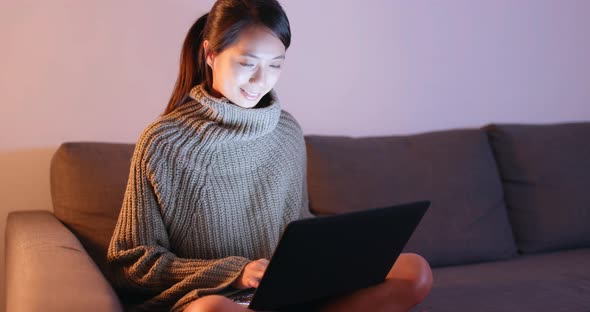 Woman work on notebook computer at home