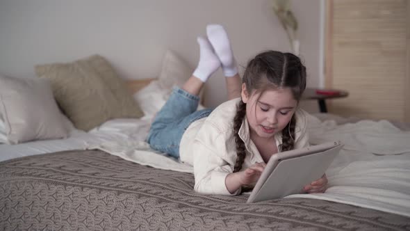 Baby Girl Playing a Game on Mobile Tablet