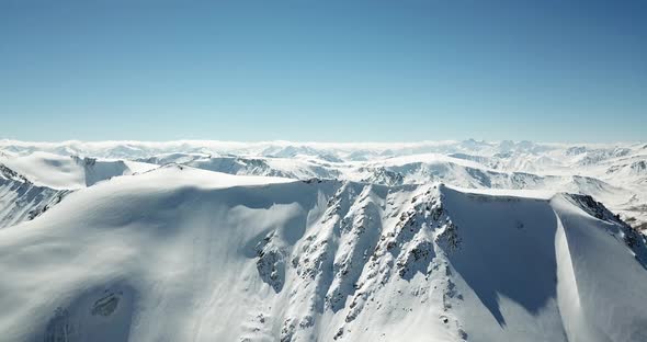 Flying Over the Tops of Snowy Mountains