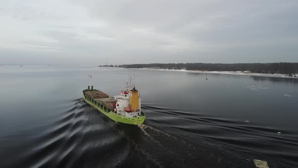 Cargo ship leaving port towards the sea