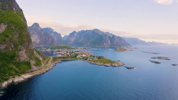 Pan Right of Reine Fishing Village with Mountains and Fjords on Lofoten Islands