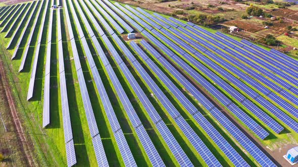 Fly Over a Renewable Solar Power Plant with Sun in Ukraine