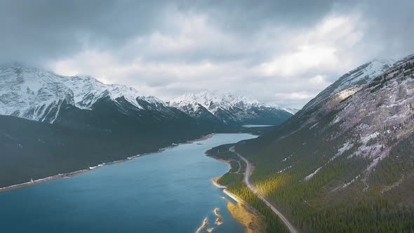 Drone video showing snow-capped mountains, forest and Spray Lakes Reservoir, Alberta, Canada