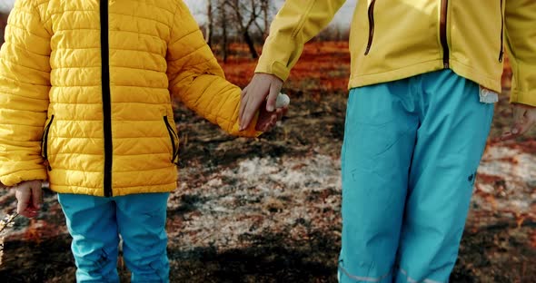 The Younger Sisters Dressed in the Colors of the Ukrainian Flag Holding Hands