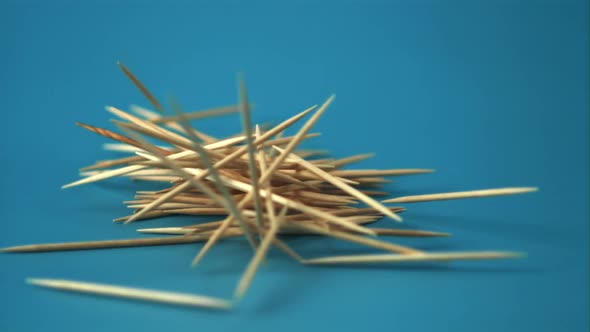 Super Slow Motion Bunch of Toothpicks Falls on the Table
