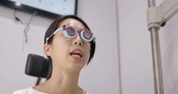 Woman visit the eye clinic undergo eye exam