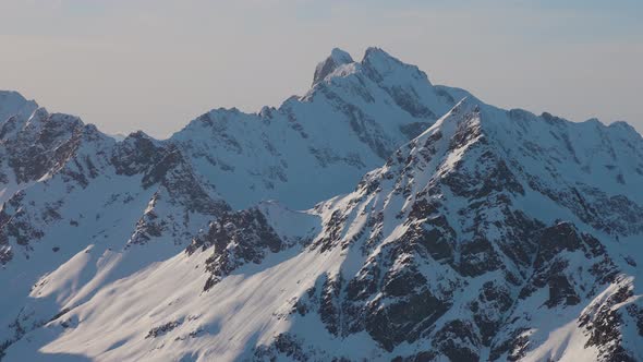 Aerial View From an Airplane of Beautiful Snowy Canadian Mountain Landscape