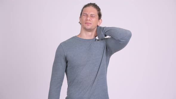 Stressed Man Having Neck Pain Against White Background