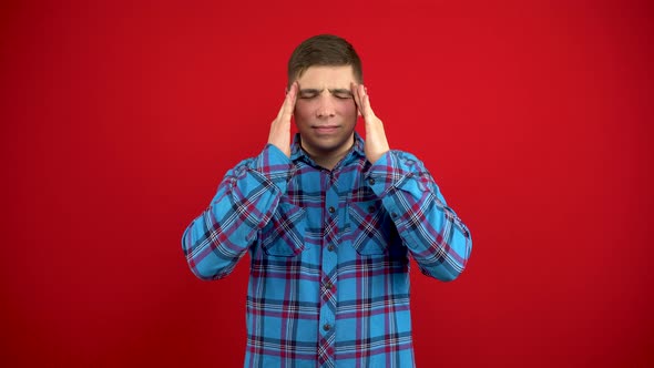 A Young Man Has a Headache She Is Massaging His Temples