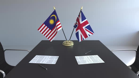 Flags of Malaysia and Great Britain and Papers alt