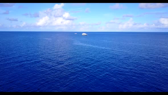 Aerial drone shot seascape of tropical sea view beach lifestyle by blue ocean with white sand backgr