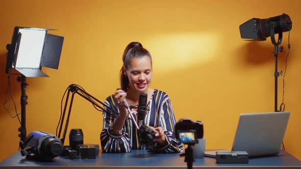 Influencer Reviewing a New Fluid Head