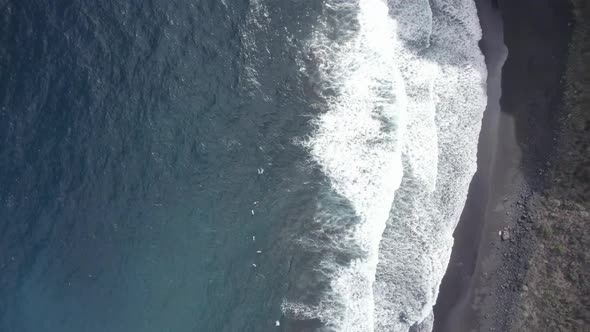 Top View Of Foamy Waves Running Ashore At Playa de Nogales In La Palma, Canary Islands, Spain With B