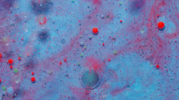 Ink Bubbles Mixed with Liquid Substance of Oil Milk Soap Bright Acrylic Paint on Colorful Surface
