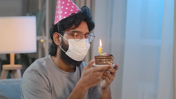 Portrait Arabian Ill Sick Indian Bearded Sad Man in Medical Face Mask Sitting Alone at Home Wears