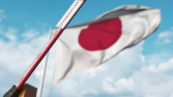 Barrier Gate with QUARANTINE Sign Being Closed at Flag of Japan
