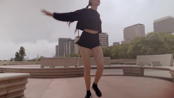 Happy Caucasian Woman Dancing Alone in the Street