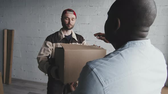 Mover Handing Box to Homeowner