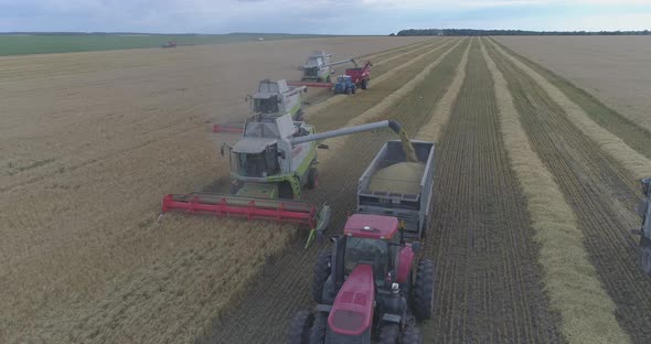 Aerial view of tractor and combine working together