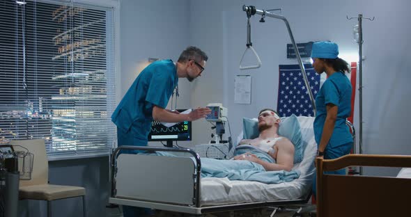 Doctor Visiting Injured Soldier in Hospital