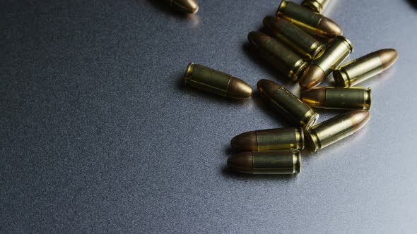 Cinematic rotating shot of bullets on a metallic surface - BULLETS 043