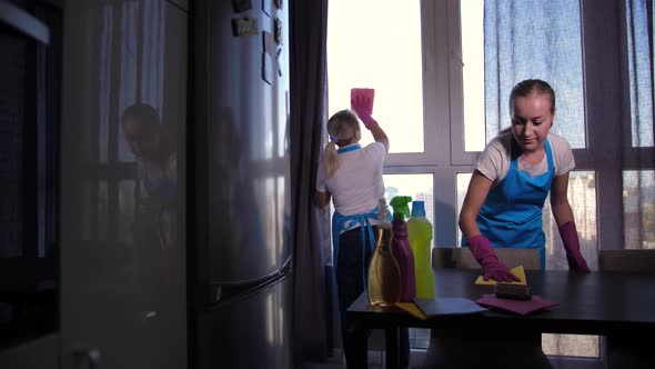 Two Female Cleaners in Gloves Working in Apartment