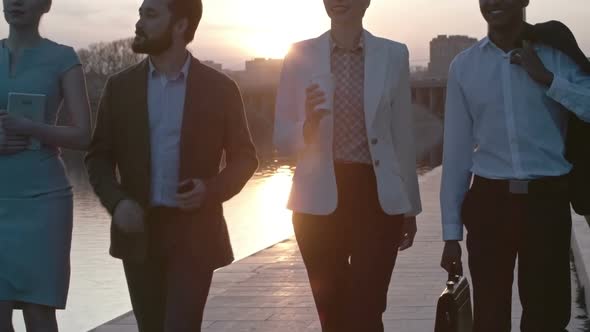 Business Partners Walking at Sunset