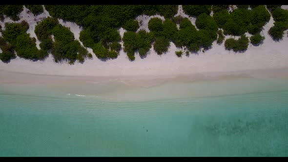 Aerial flying over sky of relaxing coast beach time by blue water and white sand background of a day