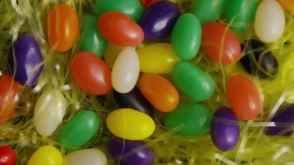 Rotating shot of Easter decorations and candy in colorful Easter grass - EASTER 007