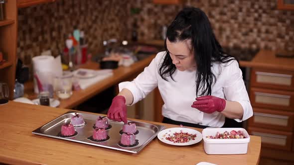 Professional Female Confectioner is Making Dessert