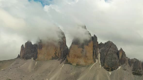 Clouds moving over Three peaks Unesco mountain range Dolomites, Italy