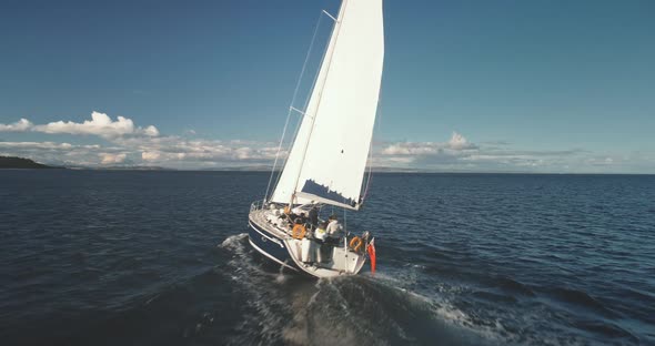 Closeup of Yacht Cruise at Open Sea with Passengers Aerial alt