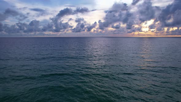 Aerial view Beautiful view sunset or sunrise over sea surface beautiful wave Amazing light twilight