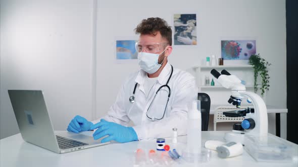 Doctor Working on Computer in His Office