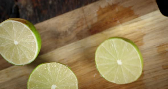 Halves of a Ripe Lime on the Cutting Board. 