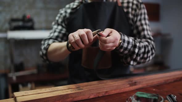 Leather Handbag Craftsman at Work in a Workshop