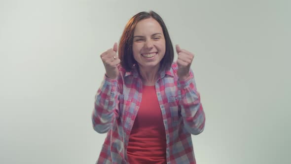 Young woman being happy for a victory