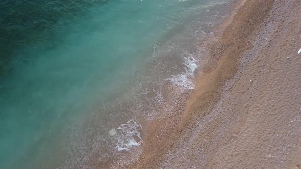 Aerial Panoramic View of Beautiful Sunset Above Calm Azure Sea and Volcanic Rocky Shores