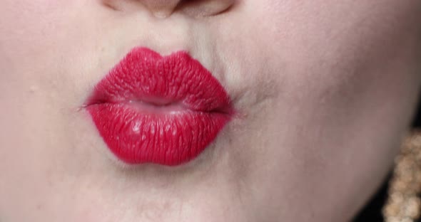 Woman's Lips Kissing in Close-up.