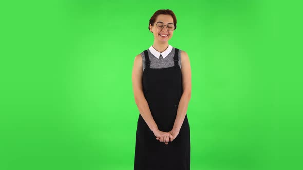 Funny Girl in Round Glasses Is Standing Worrying in Expectation Then Proud of Himself. Green Screen