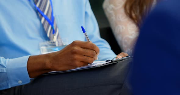 Business people writing on notepad in the business seminar 4k