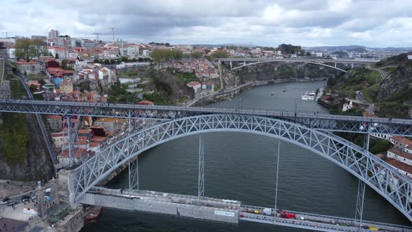 Overhead shot of Dom Luís I Bridge with Pedestrians on the Elevated Walkway, Aerial Tilt Down