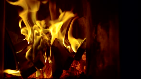 The Fire Burns with a Bright Flame in the Stove for Heating the Bath. Close-up Slow-motion Shooting